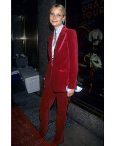 a woman in a red suit and white shirt