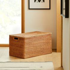 a basket sitting on the floor next to a door