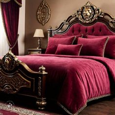 a bed with red comforter and pillows in a luxurious bedroom setting that has gold trimmings on the headboard