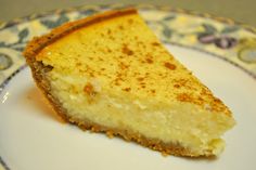 a slice of cheesecake sitting on top of a white plate