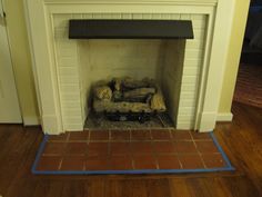 a fire place in a living room next to a door