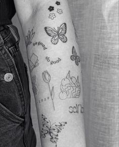 black and white photo of woman's arm with butterfly tattoos on her left arm