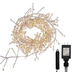 a white and gold string light with an extension cord