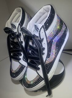 This listing is for High Top Vans shoe only!  Custom Rhinestone High-Top Vans.  These shoes will definitely make someone jealous! One of a kind, gorgeous Vans that are all hand placed stones.  Perfect for a special outfit, a special event or even for a special person that has a sparkling personality! All sales are final. Rhinestone Vans, Bejeweled Shoes, Rhinestone Converse, Mickey Shoes, Bedazzled Shoes, Diamond Shoes, Custom Rhinestone, All Star Shoes, Bling Shoes