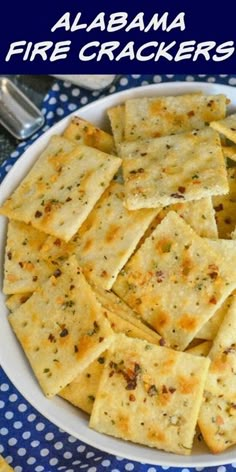 a white bowl filled with crackers on top of a blue and white table cloth