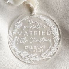 a glass ornament that says, have yourself a married little christmas