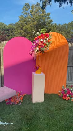 an outdoor area with various colored furniture and flowers