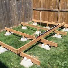 the raised garden bed is ready to be built into the yard with grass growing in it