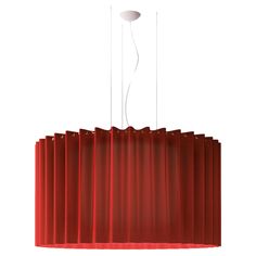 a red light hanging from a ceiling with curtains on the bottom and two lights above it