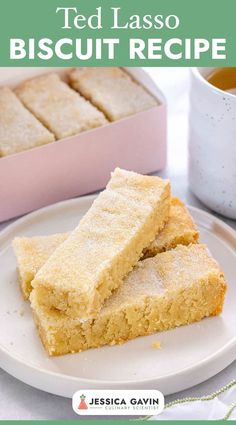 two pieces of cake sitting on top of a white plate next to a cup and saucer