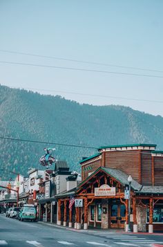 a small town with mountains in the background