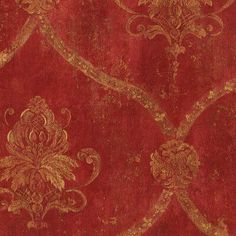 an old red and gold wallpaper with ornate designs on the edges, including swirls