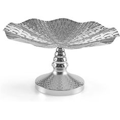 a silver plate that is sitting on top of a metal stand with an intricate design