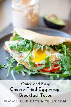 an egg and cheese sandwich on a plate with text overlay that reads quick and easy chees - fried egg - wrap breakfast tacos