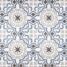 a blue and white tile pattern with an intricate design in the center, on a wall