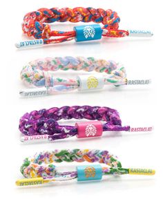 four bracelets with different colors and designs on each one, including the logo for starbucks