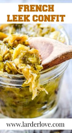 a jar filled with french leek confit on top of a wooden spoon