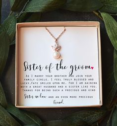 the sister of the groom necklace is in a box with leaves around it and has a poem