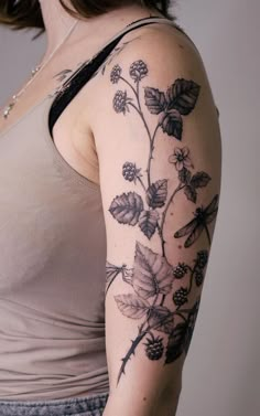 a woman with a tattoo on her arm