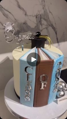 a cake made to look like an open book with keys and keychains on top