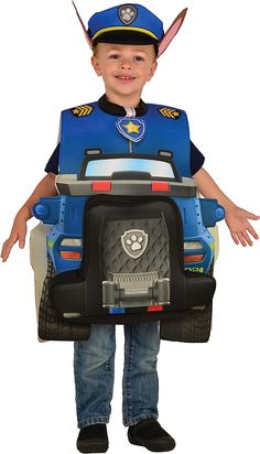 a young boy wearing a police officer costume and holding a toy car in his hands