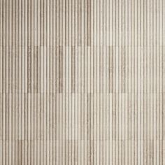 a beige tile wall with vertical stripes in the center and diagonals at the bottom