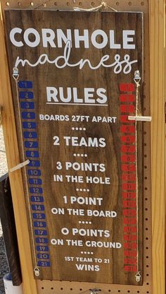 a sign that is on the side of a wooden board with rules and numbers in it