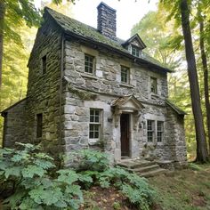 an old stone house in the woods