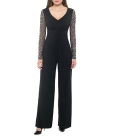 From Marina&#x2C; this jumpsuit features:matte jersey fabrication v-necklinesheer beaded long sleeves knot detail in the front lined&#x2C; excluding sleeves back zip closure approx. 59" from shoulder to hem approx. 32" inseam polyester/spandexmachine wash cold/ tumble dry low Made in the USA. Printed Rompers, Dillard's, Wide Leg Jumpsuit, Jumpsuits For Women, Black Silver, Pant Jumpsuit, Jumpsuit Romper, Size 16, Bodice