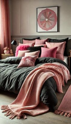 a bedroom with pink and black bedding