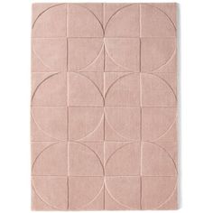 a pink rug with circles on it