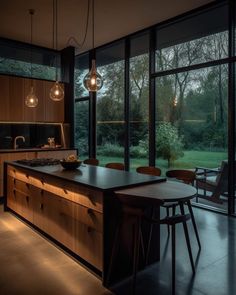 a kitchen with large windows and wooden cabinets