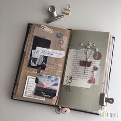 an open book with pictures and keys on it