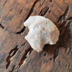 a piece of rock sitting on top of a wooden table