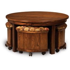 an oval table with two stools underneath it and a round wooden table on wheels