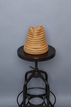 a hat sitting on top of a stool