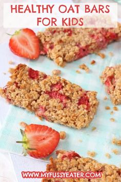 some granola bars with strawberries on the top and one half cut in half