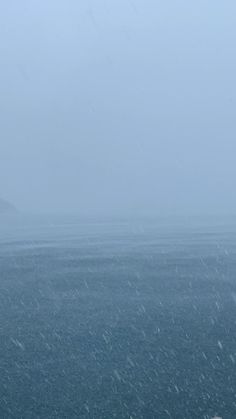 two people walking in the snow with an umbrella