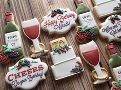 decorated cookies with wine glasses and grapes on them for 70th birthday party or anniversary celebration