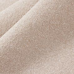 close up view of the fabric textured with light brown and beige tones on a white background