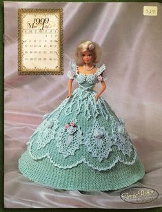 a crocheted doll is wearing a dress with flowers on the bouncy