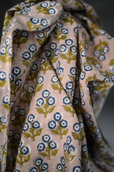 a close up of a tie with flowers on it