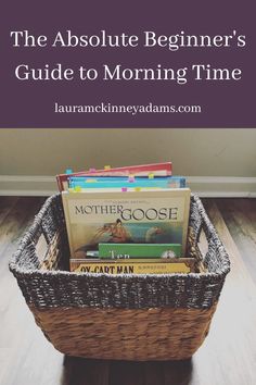 a basket filled with books on top of a wooden floor