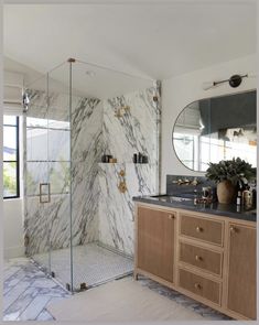 a bathroom with marble and wood accents