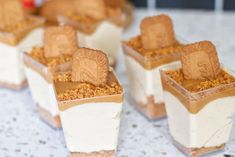 small desserts with peanut butter and graham crackers in them on a white table