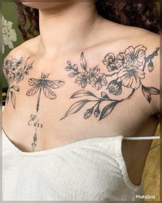 a woman's chest with flowers and dragonflys on her left side shoulder