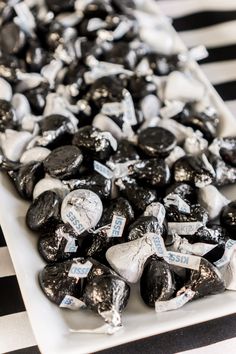 black and white candies are on a plate