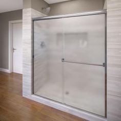 an empty room with a glass shower door