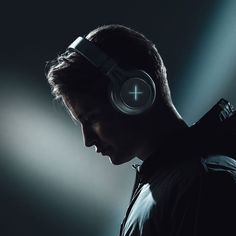 a man wearing headphones in the dark