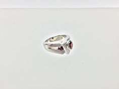 "Hi everyone, just wanted to let you know we are open and shipping daily. Silver Garnet Ring // Matte Platinum (Rhodium) Finish // Handmade // Modern Design // Size 7 Beautifully crafted \"one of a kind\" contemporary Sterling Silver ring with genuine Garnet center stone. This garnet is of a deep ruby red color. The silver ring is finished with Rhodium so it will not tarnish. This fine jewelry quality ring is perfect for work and formal occasions to match your sterling, white gold or platinum je Modern Sterling Silver Birthstone Ring For Formal Events, Modern Sterling Silver Birthstone Ring For Formal Occasions, Modern Garnet Jewelry For Anniversary, Modernist White Gold Ring For Gift, Modernist White Gold Ring As Gift, Modernist White Gold Rings For Gifts, Modernist White Gold Ring Gift, Modern Sterling Silver Solitaire Rings, Modern White Gold Ruby Ring For Anniversary